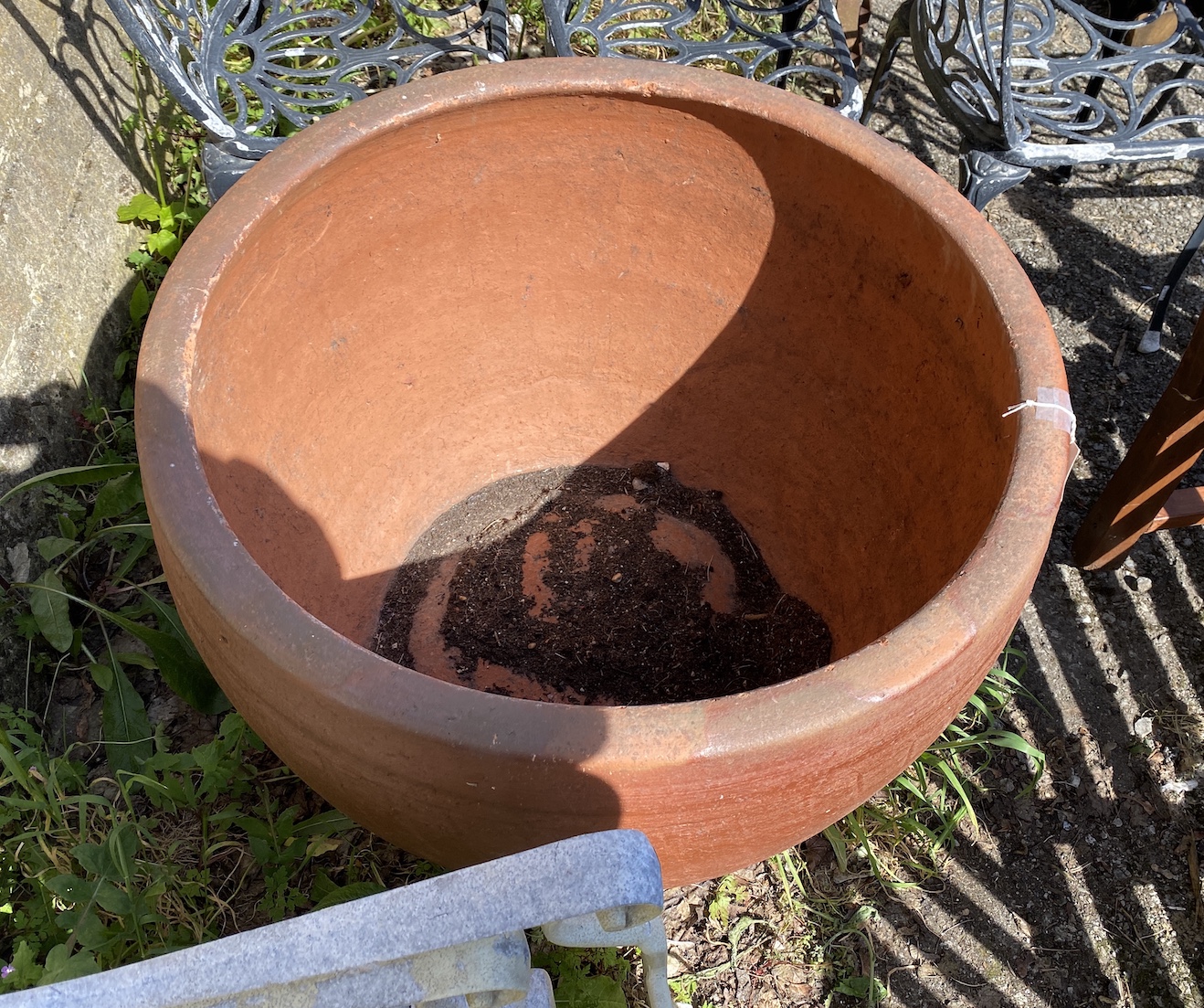 A large circular terracotta planter, diameter 85cm, height 62cm